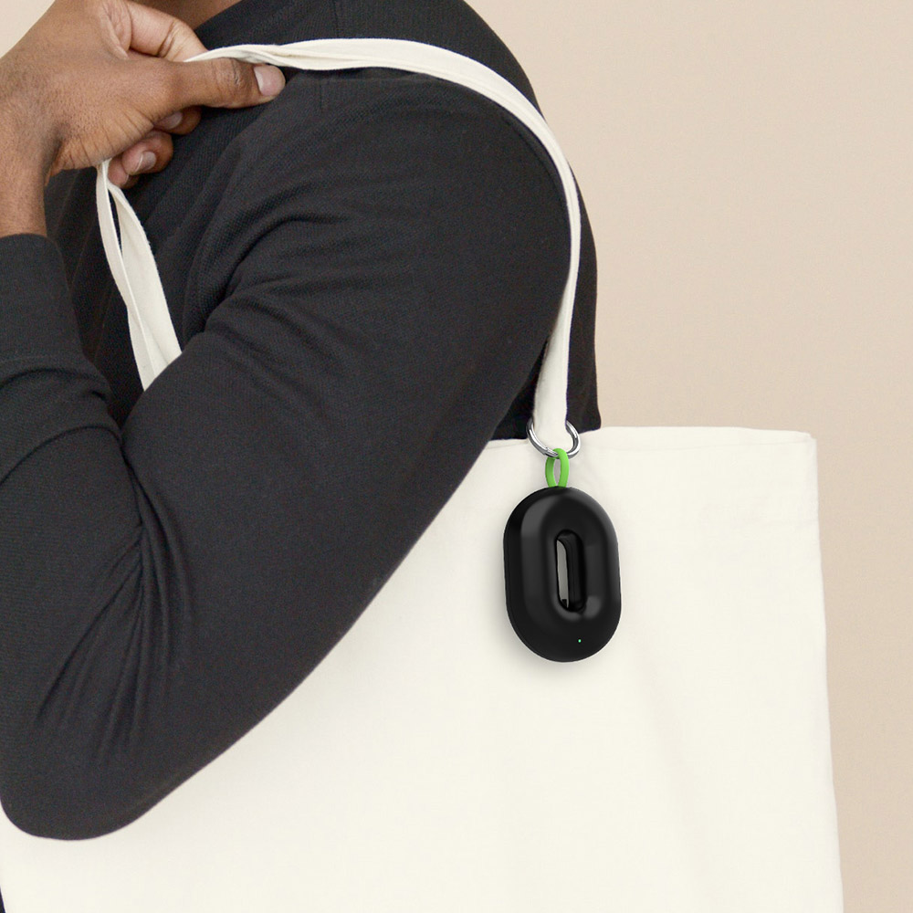 charm air purifier pendant on tote bag