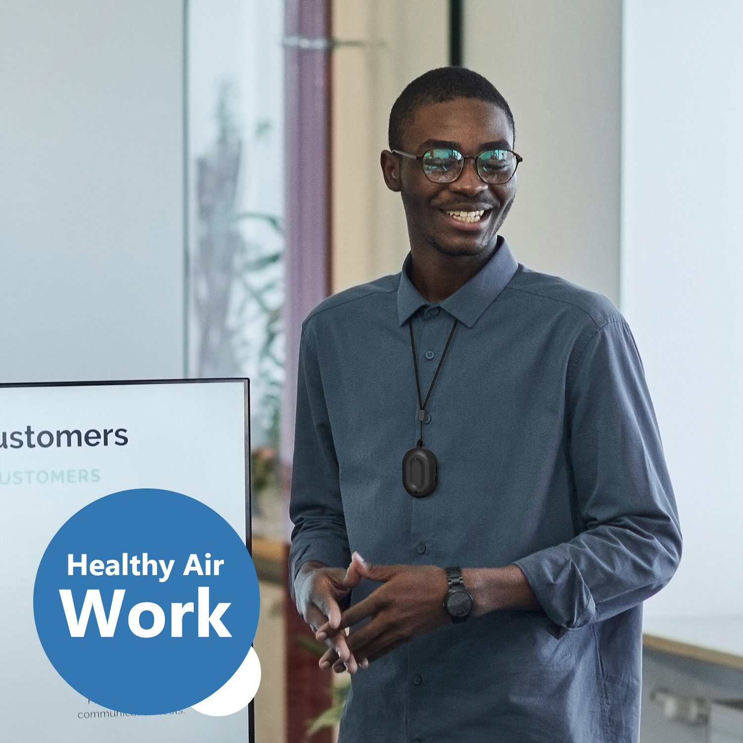 staff wearing personal wearable air purifier at work, office